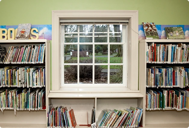 Library window with WindowSLIP installed, surrounded by bookshelves filled with books.